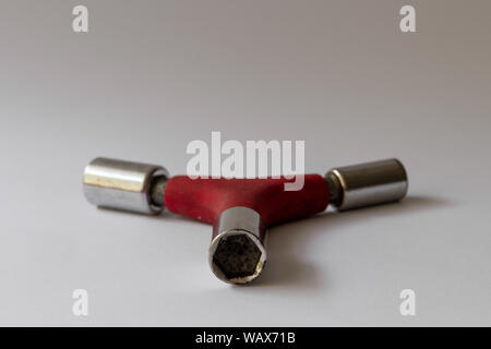 Close-up of an old well used three way hex tool isolated on a white surface Stock Photo