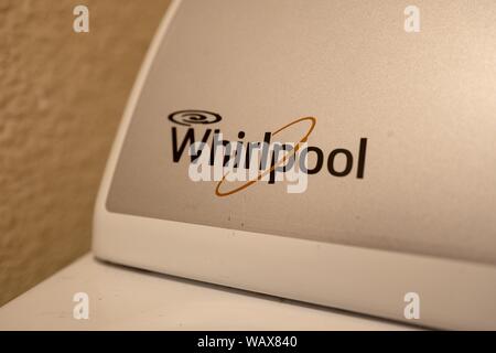 Close-up of logo for appliance company Whirlpool on a clothes dryer in a domestic room, August 21, 2019. () Stock Photo