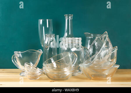 Glassware. Glass plates, cups, bowls Dishes on the shelf Kitchenware Stock Photo