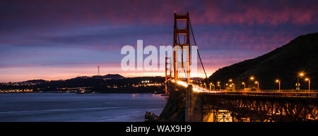 Golden Gate Bridge, San Francisco, USA photographed at Sunset. the beautiful sunset colours add magic to the scene. Stock Photo