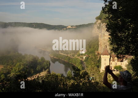 Panoramic scene of morning mist rising from the river over the valley Stock Photo