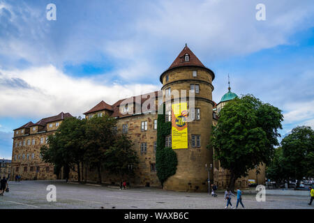 Stuttgart, Germany, August 15, 2019, Many people walking over cobblestone square at schillerplatz around famous ancient building of old castle which i Stock Photo