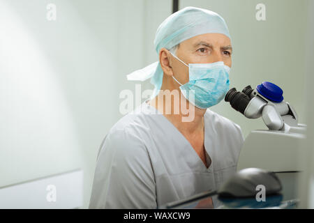Nice good looking man working as an ophthalmologist Stock Photo