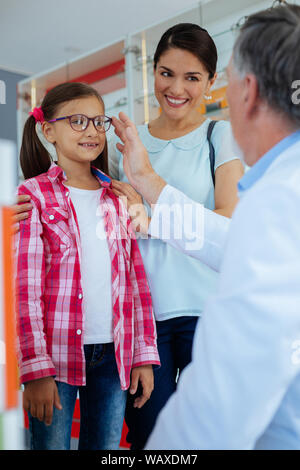 Nice pretty girl trying on her new glasses Stock Photo