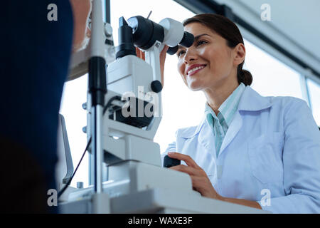 Delighted professional doctor doing her favourite job Stock Photo