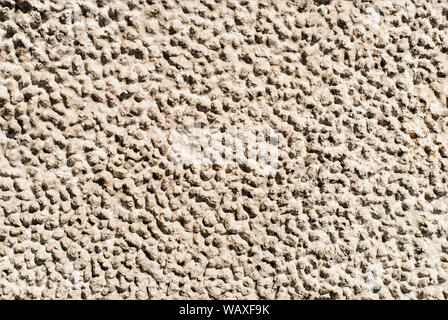 seamless texture - gray rough dried clay with traces of raindrops Stock Photo