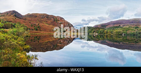 Llyn Dinas in Nant Gwynant valley near Beddgelert looking west with Moel Hebog in background Snowdonia National Park North Wales UK October 2018 Stock Photo