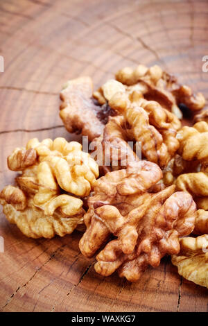 Close up picture of walnuts on a wooden table, selective focus. Stock Photo