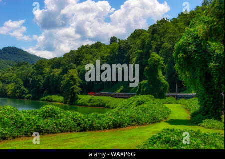 Bryson, North Carolina, USA - August 3, 2019:  View of Nantahala Lake as seen from one of many passenger cars on a train traveling through the Nantaha Stock Photo