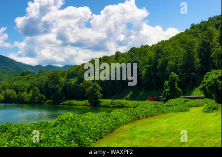 View of Nantahala Lake as seen from one of many passenger cars on a train traveling through the Nantahala National Forest. Stock Photo