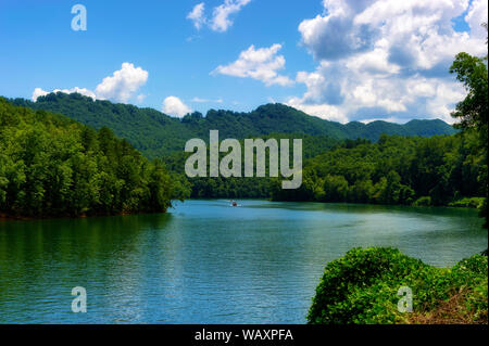 River view with two boats seen from a moving train traveling through the Nantahala National Forest Stock Photo