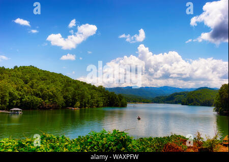 Lake activities, boating,marina seen from a moving train traveling through the Nantahala National forest. Stock Photo