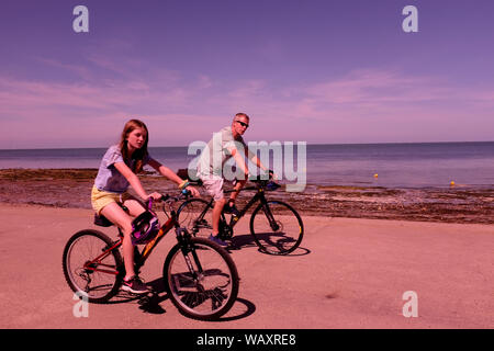 cyclists in joss bay broadstairs kent uk august 2019 Stock Photo