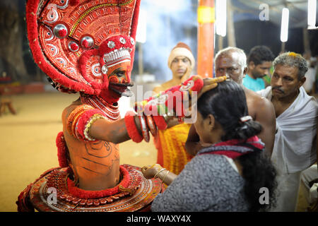 Dancer at a traditional Theyyam ceremony in a temple in Kannur, India. Theyyam is Kerala's most popular ritualistic art form. Stock Photo