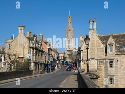 View from the Town Bridge up the stone built street of St Mary's Hill to the Church of St Mary the Virgin in Stamford Lincolnshire Stock Photo