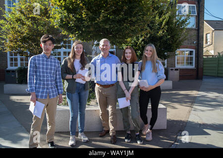 Kingston Grammar School students celebrate and congratulate each other as they receive their GCSE Results Stock Photo