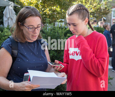 Kingston Grammar School students celebrate and congratulate each other as they receive their GCSE Results Stock Photo