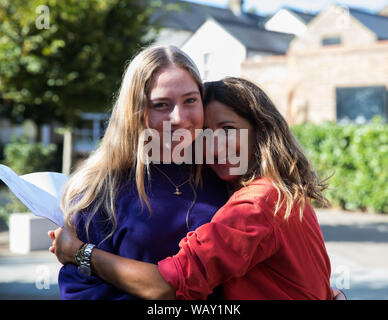 Kingston Grammar School students celebrate and congratulate each other as they receive their GCSE Results Stock Photo