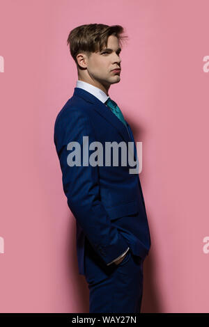 Elegant Young Handsome Man Posing In Fashionable Suit And Eyeglasses.  Studio Shot. Stock Photo, Picture and Royalty Free Image. Image 64307940.