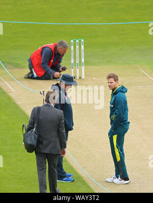 Leeds, UK. 22nd Aug, 2019. Mark Nicholls, Trevor Bayliss Head Coach of England and Steve Smith of Australia discuss the pitch during day one of the 3rd Specsavers Ashes Test Match, at Headingley Cricket Ground, Leeds, England. Credit: ESPA/Alamy Live News Stock Photo