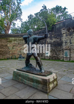 Statue of Robin Hood outside the walls of Nottingham Castle in England Stock Photo