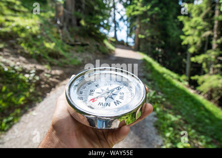 Man Playing Geocaching Game In Mountains In Summer Stock Photo