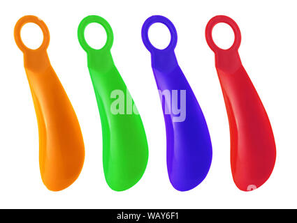 Set of colorful Shoehorns isolated on white background. There is orange, green, blue and red small spoon. You can put your shoes on comfortably. Stock Photo