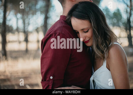 woman with head on man's chest with eyes closed Stock Photo