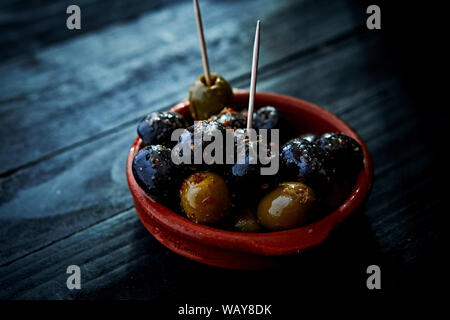 Olives in  a Tapas-Bowl at a Tapas Bar. Stock Photo