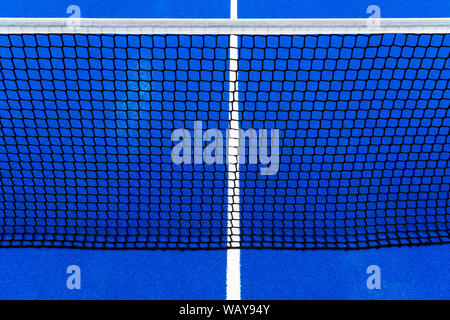 Detail of a Blue Tennis court with black net on Outdoor Stock Photo