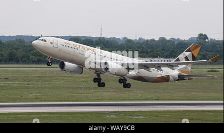 DUSSELDORF, GERMANY - MAY 26, 2019: Etihad Airways Airbus A330-243 (CN 729) takes off from Dusseldorf Airport.