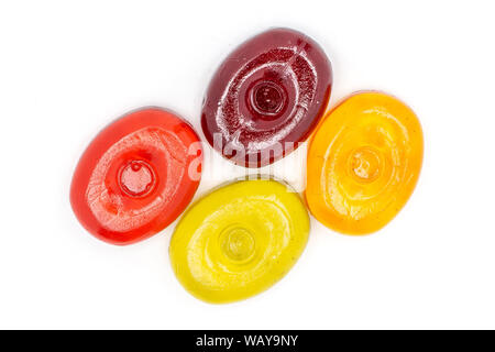 Group of four whole colourful hard candy flatlay isolated on white background Stock Photo