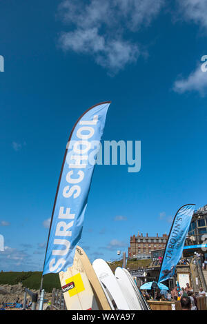 A brightly coloured banner advertising the Surf Hire equipment in Newquay in Cornwall. Stock Photo