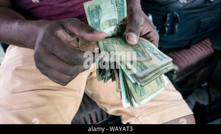 Man counting local Ethiopian currency birr notes Stock Photo