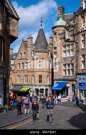 Sunny summer's day on Cockburn Street, closed to traffic during the Edinburgh Fringe Festival. Stock Photo