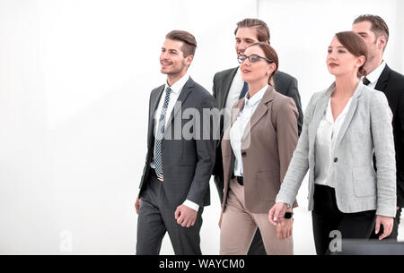 group of employees of the company confidently passes through the office hall Stock Photo
