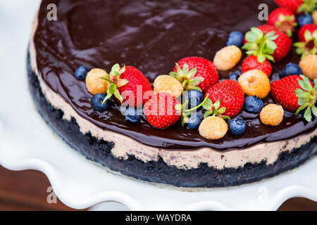 Cheese cake with chocolate and organic berries Stock Photo
