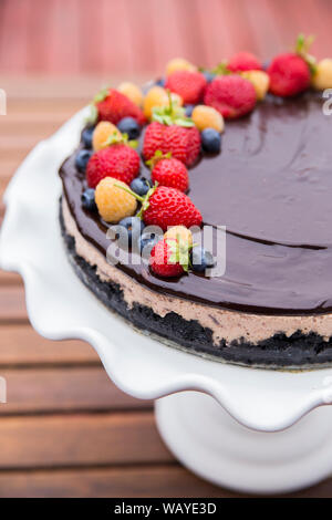 Cheese cake with chocolate and organic berries Stock Photo