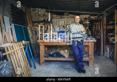 Carpenter in his workshop Stock Photo