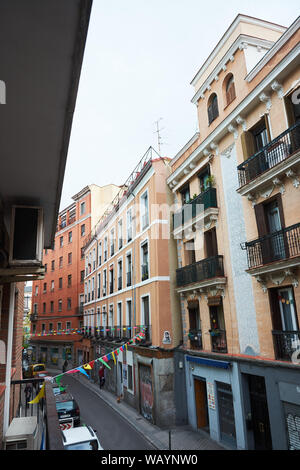 MADRID, SPAIN - APRIL 23, 2018: European architecture in a narrow street of La Latina, a famous neighborhood of the city of Madrid, Spain. Stock Photo