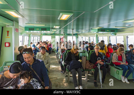 Passengers on a vaporetto (water bus) on the Venetian Lagoon (Laguna di Venezia), Laguna Veneto, Italy