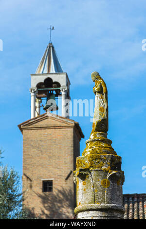 The bell tower on the Palazzo del Consiglio building, and a statue in the grounds, Torcello island, Laguna Veneto, Italy Stock Photo