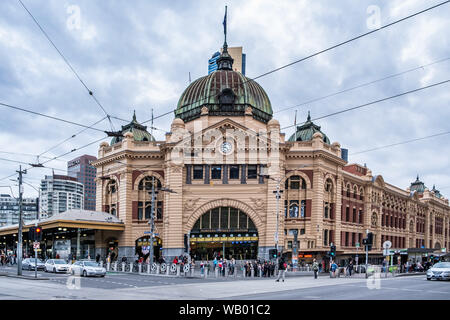 Melbourne, Australia - July 28, 2019: Busy intersection in front of Flinders Street Station main entrance Stock Photo