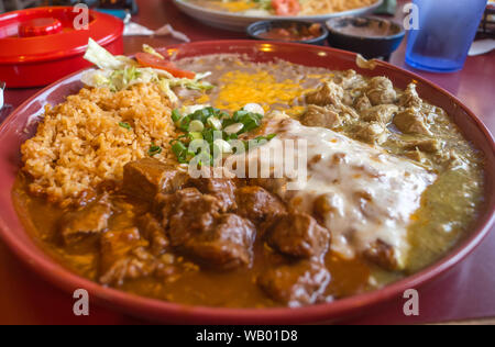 Authentic Mexican chimichanga pork burrito with sour cream jalapeno and cilantro Stock Photo