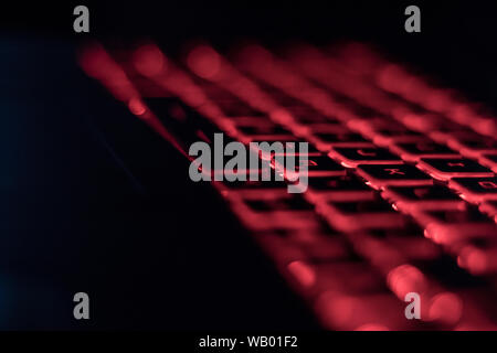 Computer keyboard red backlit in the dark Stock Photo