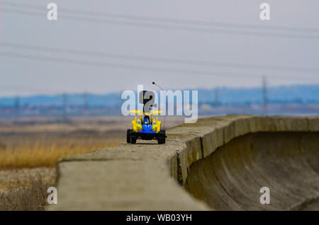 RC Remote controlled card with a Gopro action camera on it running on a narrow path Stock Photo
