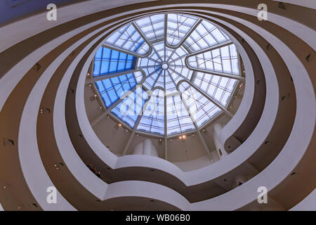 Inside one of the most impressive famous modernist masterpieces of Frank Lloyd Wright, the Guggenheim Museum, winding staircase with glass rooftop Stock Photo