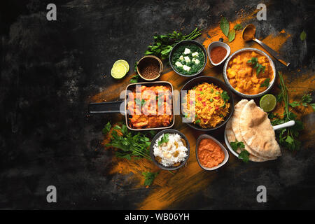 Assorted indian food on black background.. Indian cuisine. Top view with copy space Stock Photo