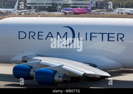 A Dreamlifter taxis into position for takeoff at Paine Field in Everett, Washington on August 22, 2019. The wide-body cargo aircraft is a modified Boeing 747-400 used to transport components of the Boeing 787 Dreamliner. Stock Photo