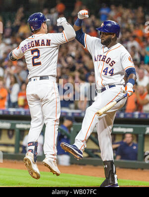 Houston Astros' Yuli Gurriel, right, gets a hug from Yordan Alvarez after  hitting a two-run home run during the third inning of a baseball game  against the Los Angeles Angels in Anaheim